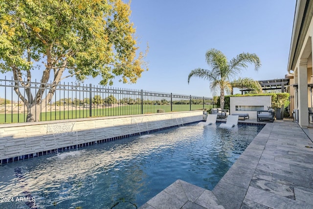 view of swimming pool with pool water feature and area for grilling