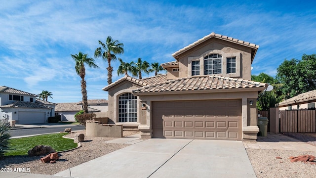 mediterranean / spanish-style house with a garage