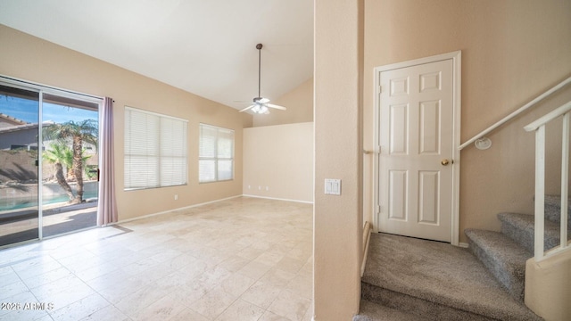 interior space with vaulted ceiling and ceiling fan