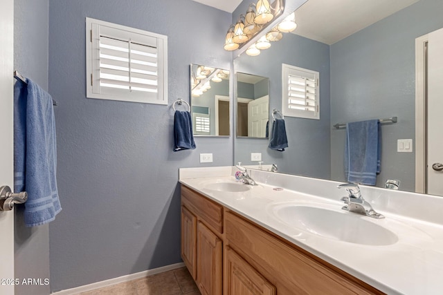 bathroom with tile patterned floors and vanity