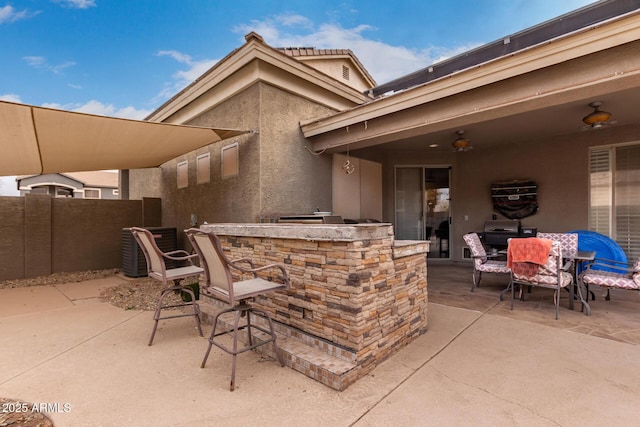 view of patio featuring exterior bar