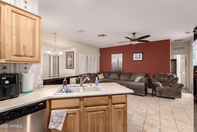 kitchen featuring light brown cabinetry, sink, hanging light fixtures, stainless steel dishwasher, and kitchen peninsula