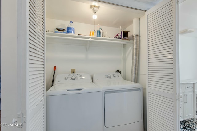 washroom featuring washer and clothes dryer