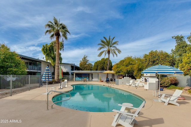 view of swimming pool featuring a patio area