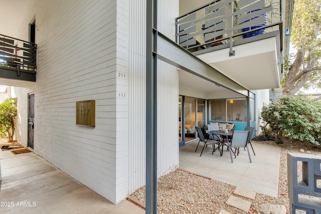 view of patio with a balcony