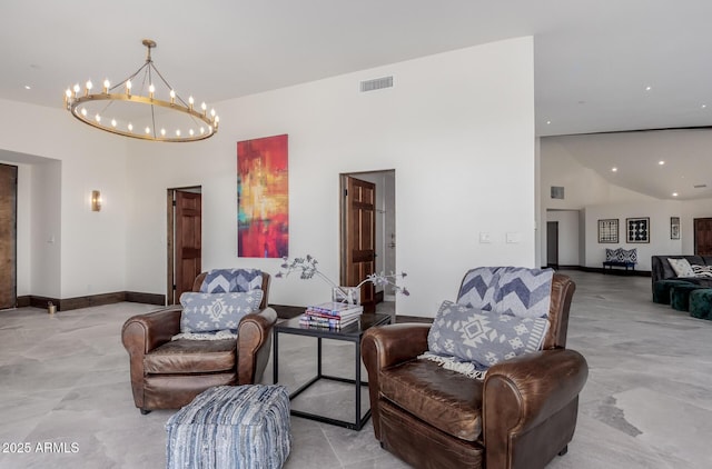 living area with an inviting chandelier and a high ceiling