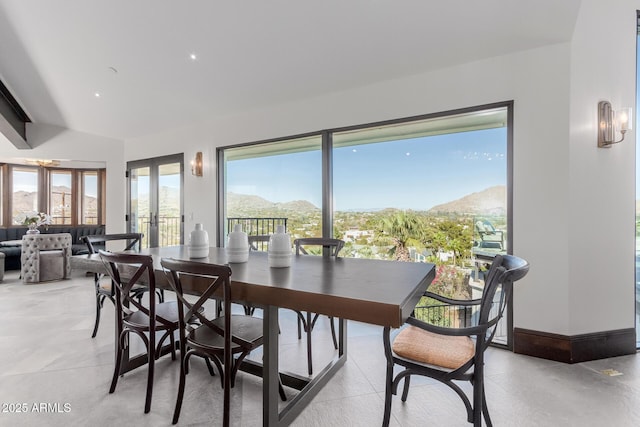 dining space featuring french doors and a mountain view