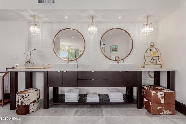 bathroom featuring vanity and an inviting chandelier