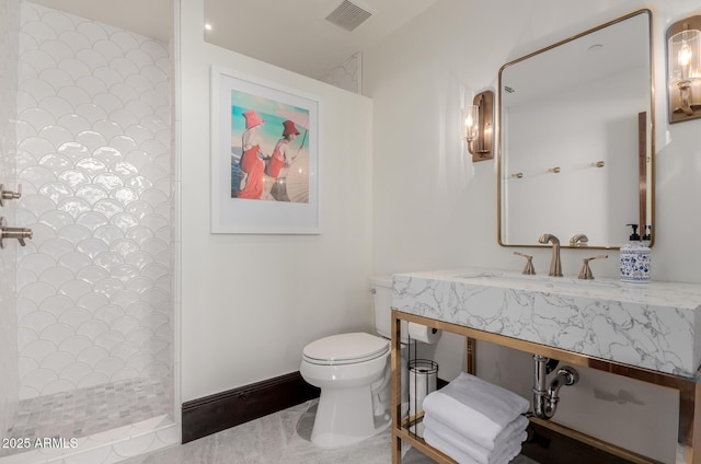 bathroom with vanity, toilet, and walk in shower