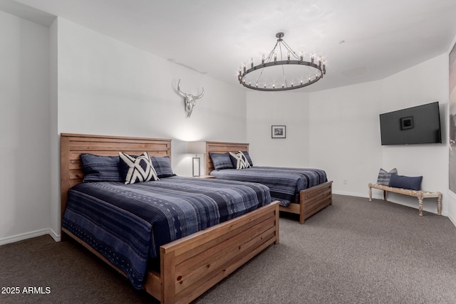 bedroom featuring a chandelier and carpet