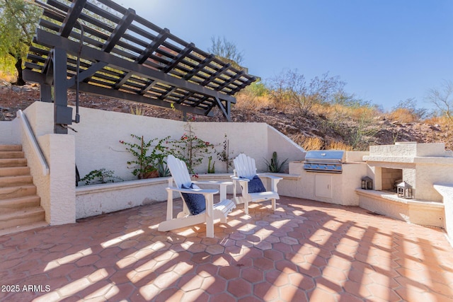 view of patio / terrace with an outdoor kitchen, a pergola, and area for grilling