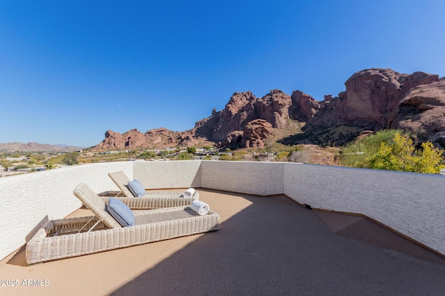 view of patio / terrace featuring a balcony and a mountain view