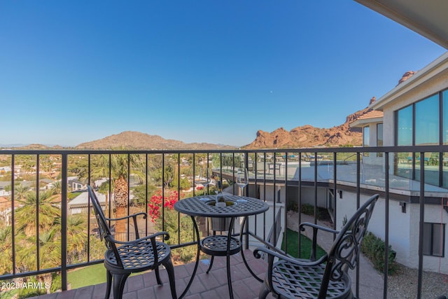 balcony featuring a mountain view