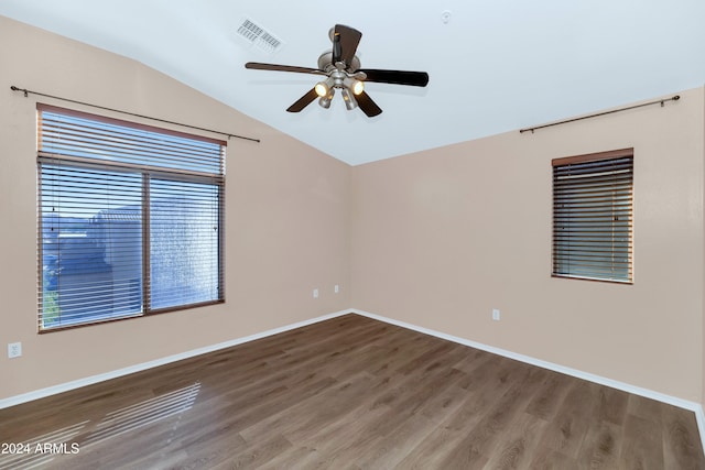 17365 N Cave Creek Rd Unit 116, Phoenix, AZ 85032 - unfurnished room with lofted ceiling, a ceiling fan, wood finished floors, and baseboards