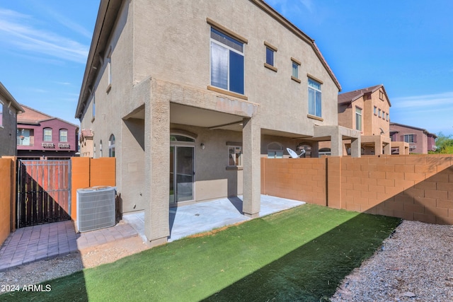 17365 N Cave Creek Rd Unit 116, Phoenix, AZ 85032 - back of property with a fenced backyard, central AC unit, stucco siding, and a patio
