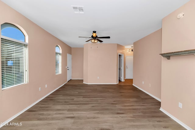 17365 N Cave Creek Rd Unit 116, Phoenix, AZ 85032 - unfurnished living room featuring ceiling fan, wood finished floors, and baseboards