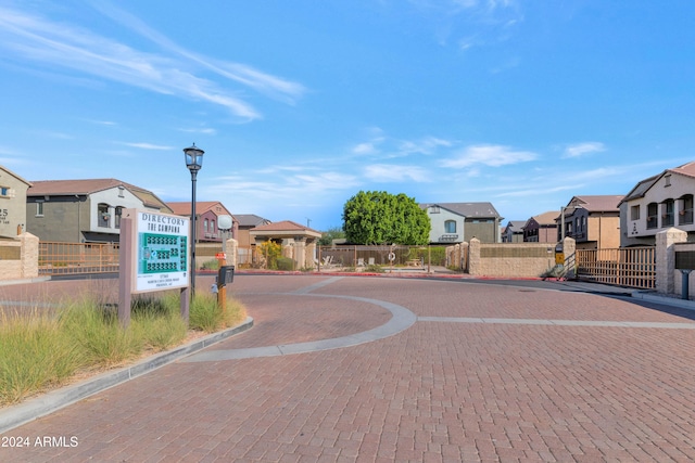 17365 N Cave Creek Rd Unit 116, Phoenix, AZ 85032 - view of decorative street with a residential view, curbs, street lights, and a gated entry