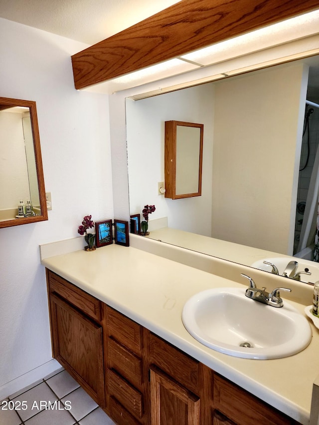 bathroom with tile patterned floors and vanity