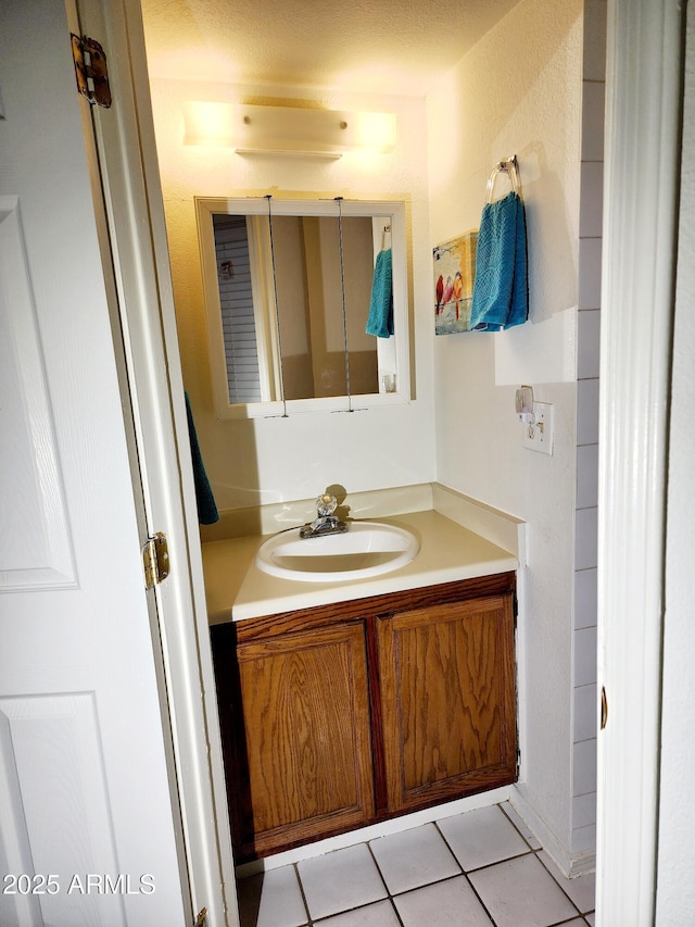 bathroom with vanity and tile patterned floors