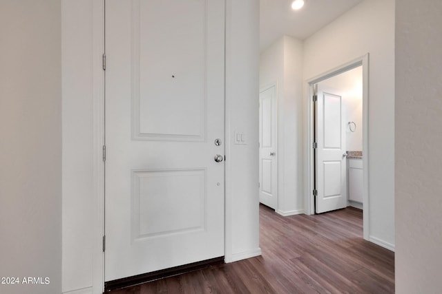 hall featuring dark wood-type flooring