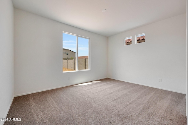 unfurnished room featuring carpet floors