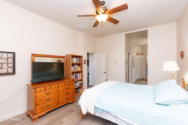 bedroom with light hardwood / wood-style flooring and ceiling fan