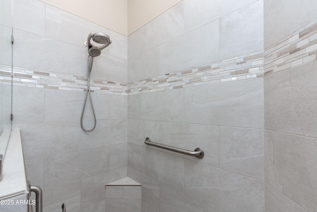 bathroom with a tile shower