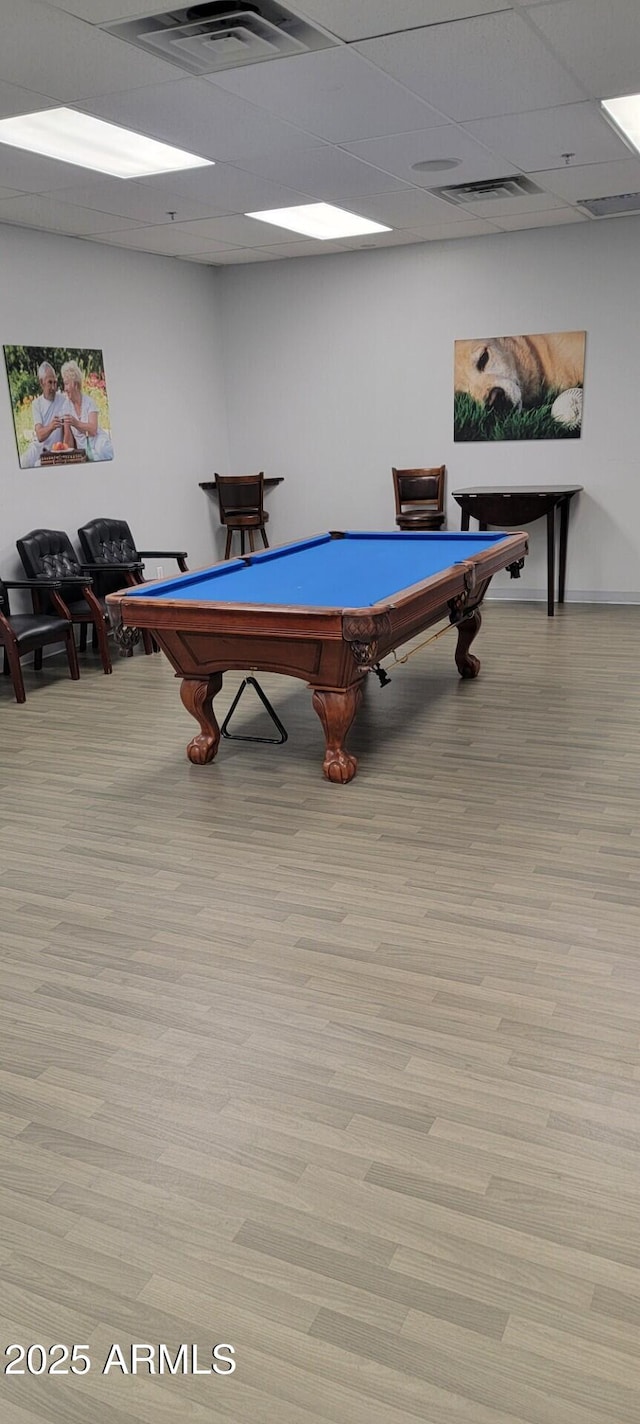 game room with billiards, a paneled ceiling, and light hardwood / wood-style floors