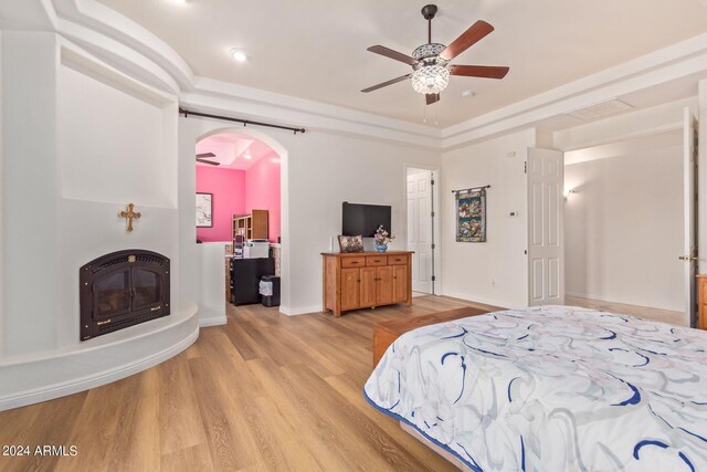 bedroom with ceiling fan and light hardwood / wood-style flooring