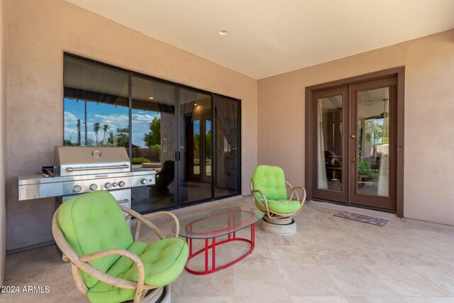 view of patio / terrace with an outdoor kitchen, area for grilling, and french doors