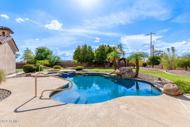 view of swimming pool with a patio area