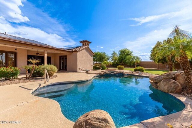 view of swimming pool with a patio