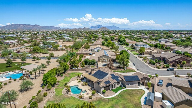 birds eye view of property with a mountain view