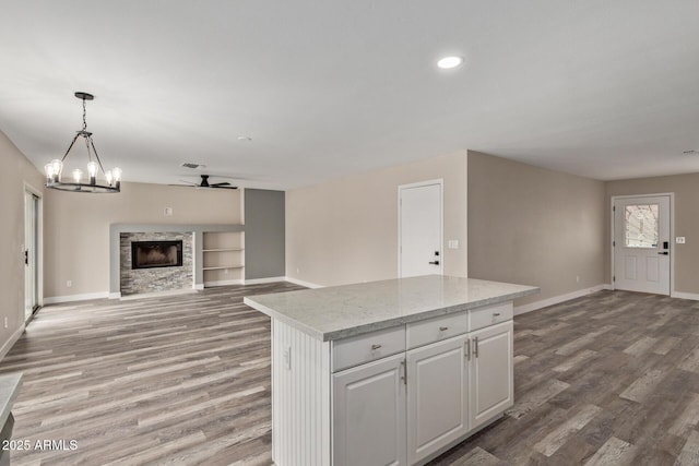 1416 W Highland St, Chandler, AZ 85224 - kitchen featuring open floor plan, baseboards, light wood-style flooring, a center island, and recessed lighting