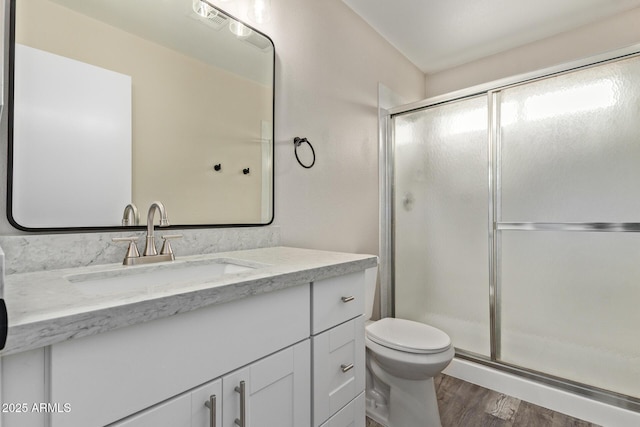 1416 W Highland St, Chandler, AZ 85224 - full bathroom featuring wood finished floors, vanity, a shower with door, and toilet