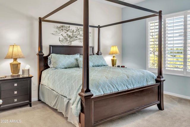 bedroom with multiple windows, carpet flooring, and baseboards