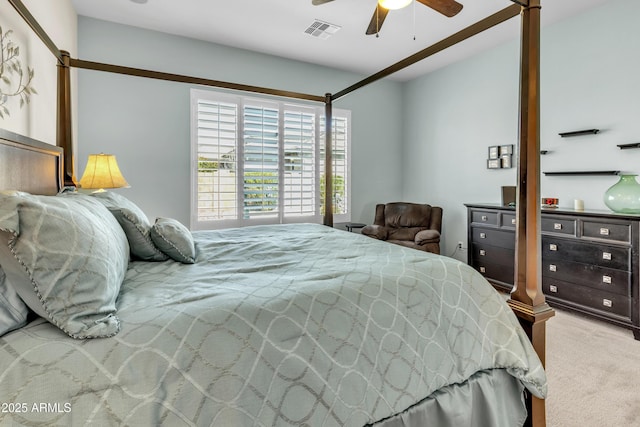 carpeted bedroom featuring visible vents and a ceiling fan