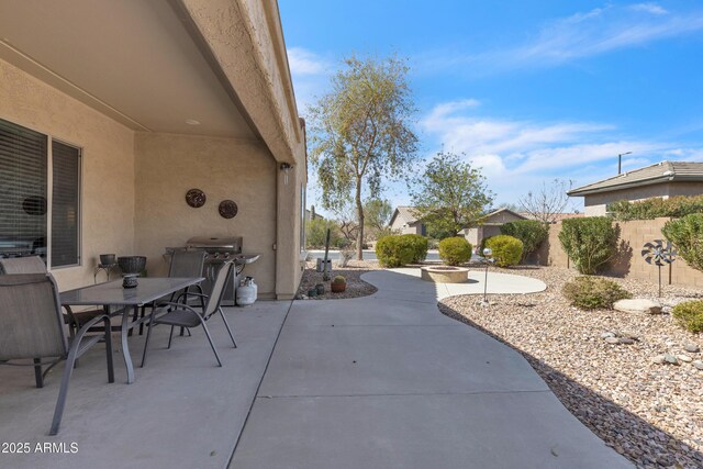 view of patio / terrace featuring area for grilling, outdoor dining area, and fence