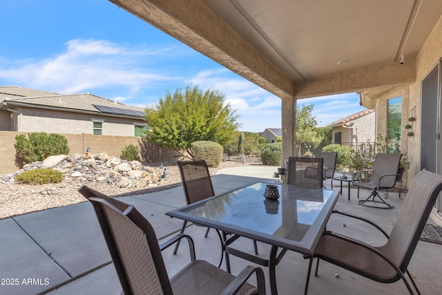 view of patio / terrace featuring outdoor dining area and a fenced backyard