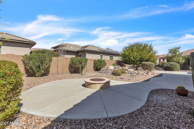 view of patio with fence and an outdoor fire pit