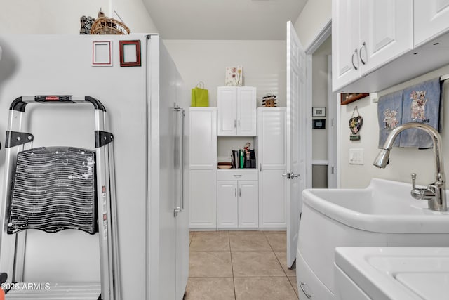 interior space with tile patterned floors and a sink