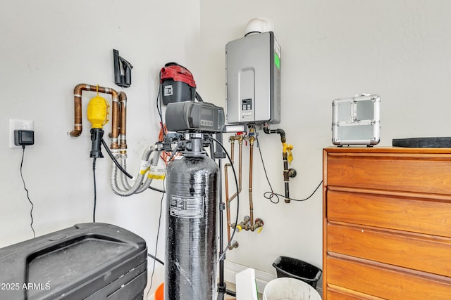 utility room featuring water heater