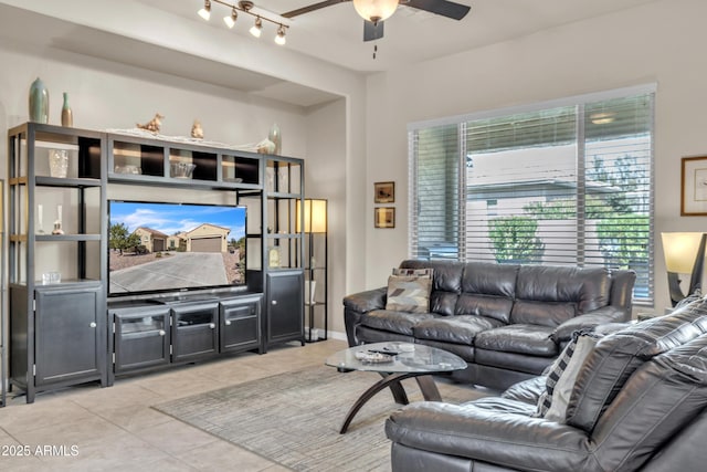 living room featuring tile patterned flooring and a ceiling fan