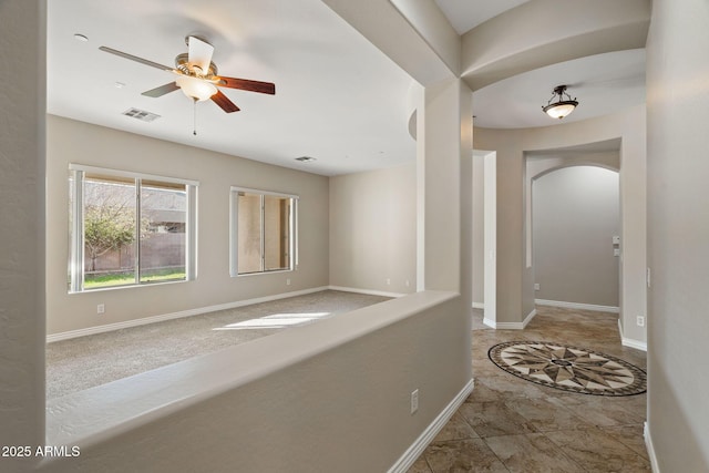 corridor featuring light tile patterned floors