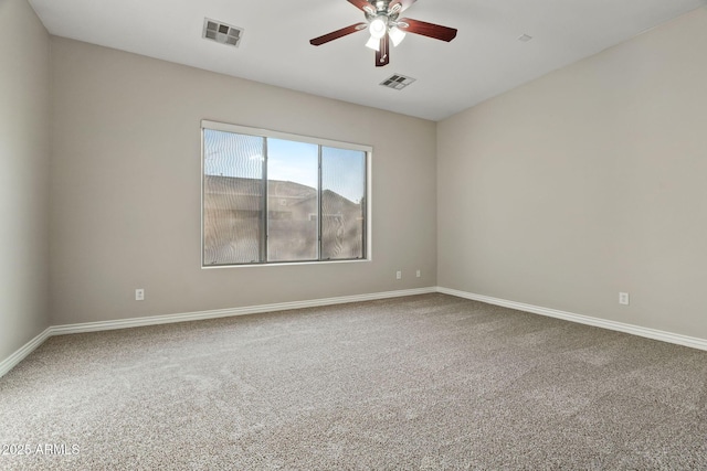 spare room with ceiling fan and carpet floors