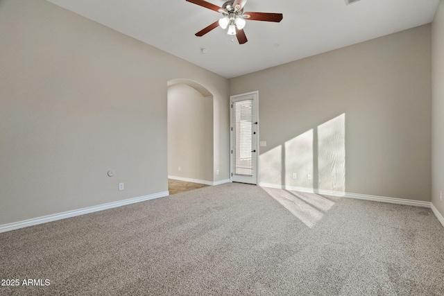 spare room featuring ceiling fan and light carpet