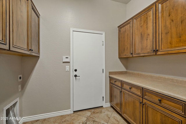 washroom with cabinets and electric dryer hookup