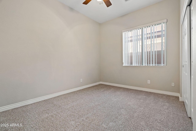 empty room with carpet and ceiling fan