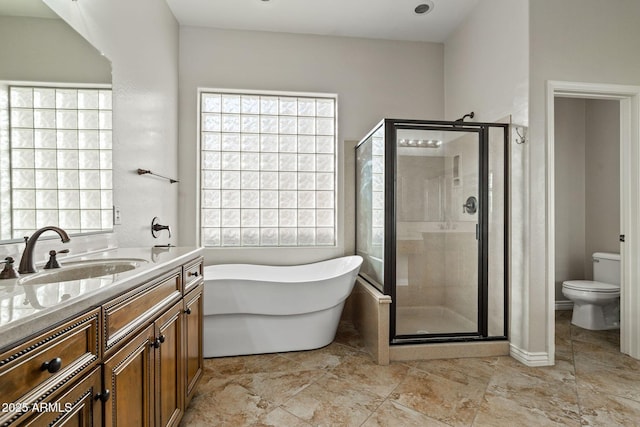 full bathroom with vanity, toilet, and shower with separate bathtub