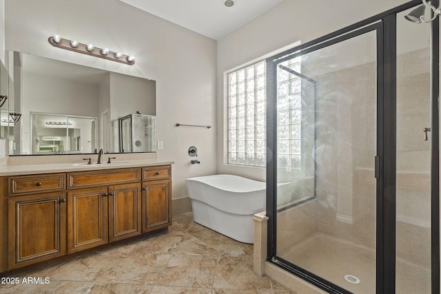 bathroom featuring vanity and separate shower and tub